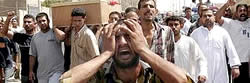 Iraqis mourn the dead.